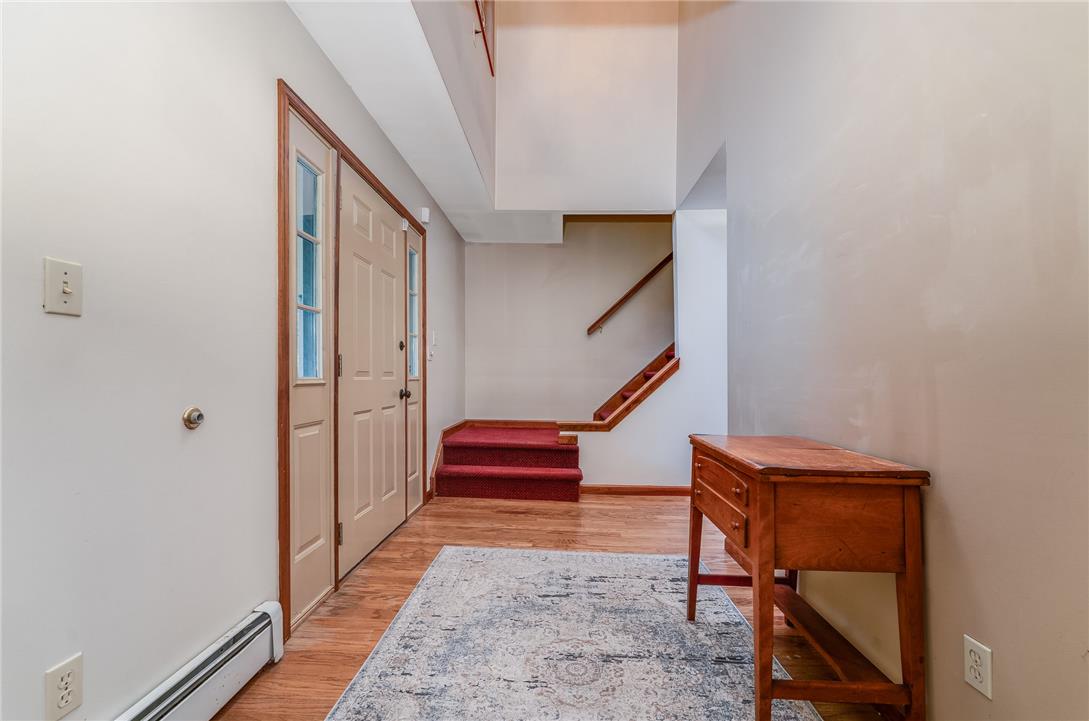 465 Raubsville Road Easton, PA 18042 - Photo 11 of 60 A welcoming entryway with warm wood floors and a striking staircase sets an inviting tone.