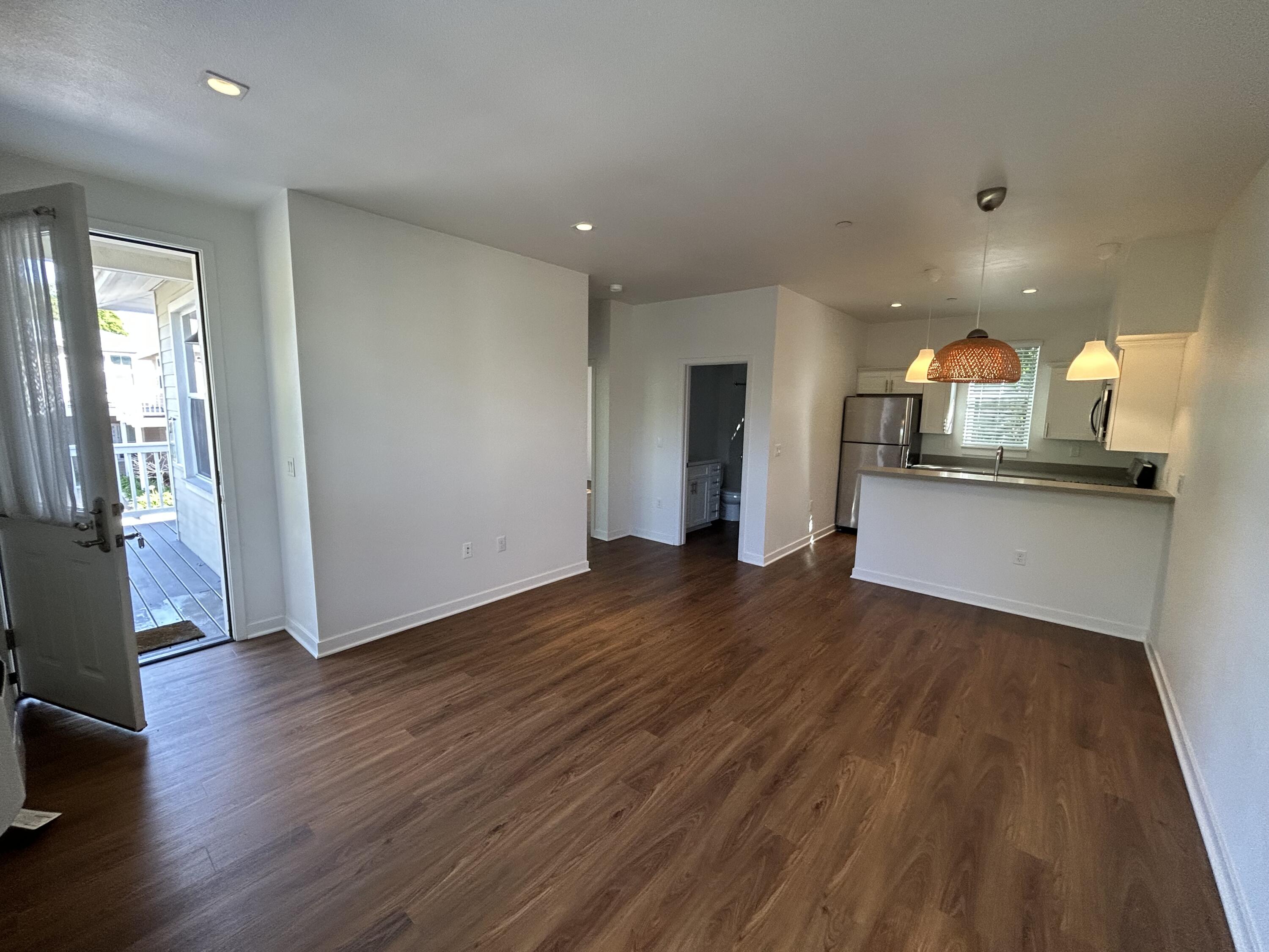 1518 Castillo Street, Unit C Santa Barbara, CA 93101 - Photo 3 of 13 a view of a kitchen with wooden floor and a sink