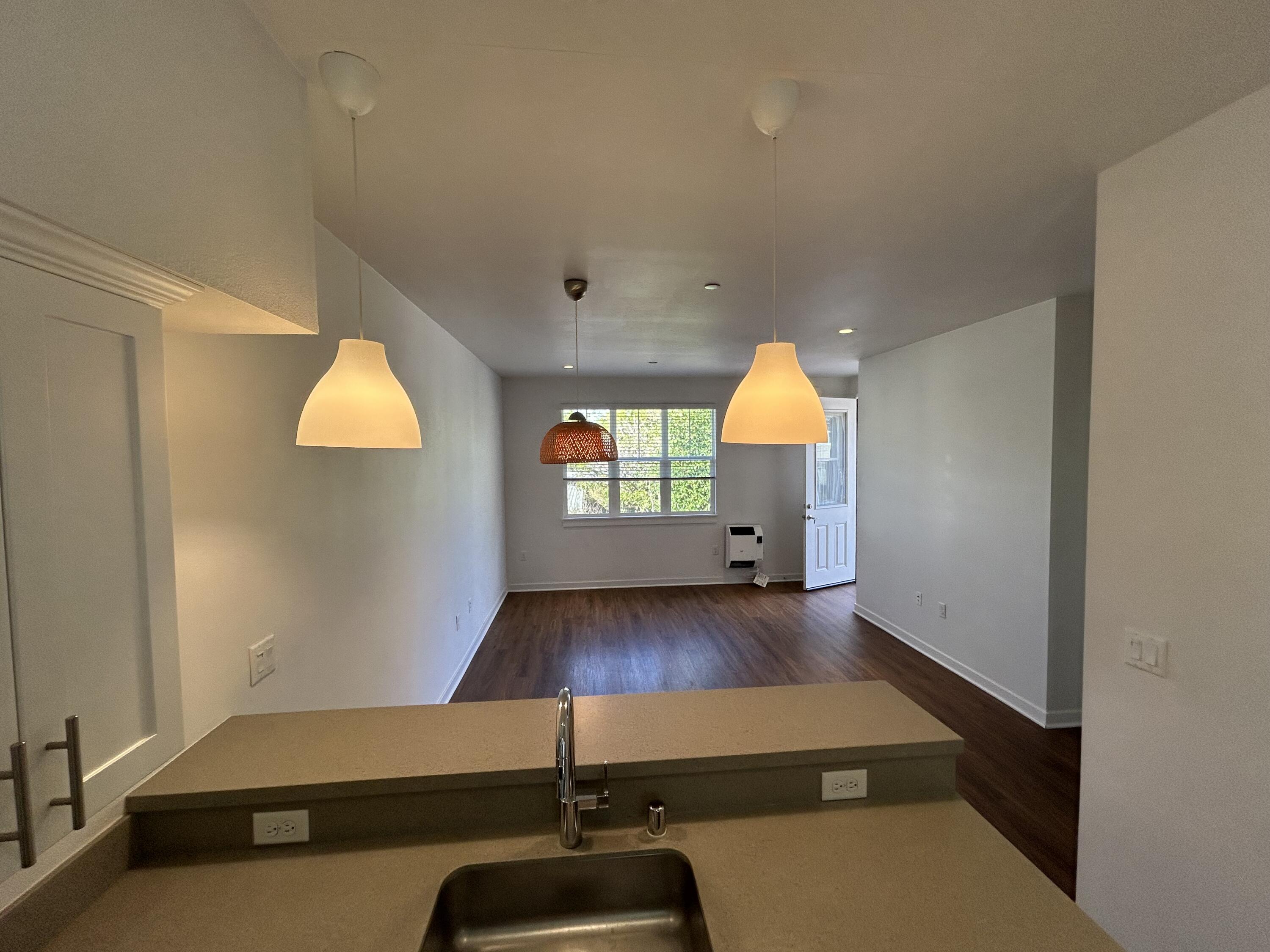1518 Castillo Street, Unit C Santa Barbara, CA 93101 - Photo 5 of 13 wooden floor in an empty room with a window