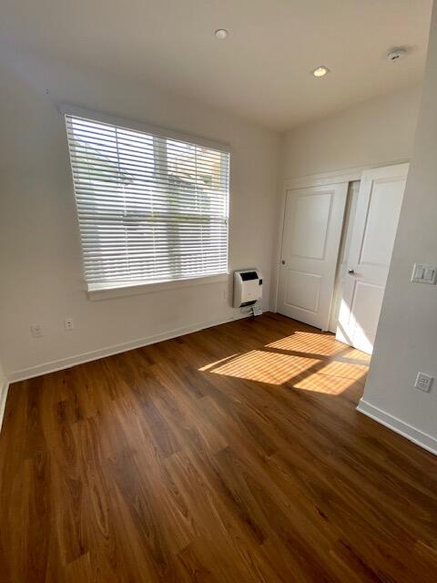 1518 Castillo Street, Unit C Santa Barbara, CA 93101 - Photo 6 of 7 an empty room with wooden floor and windows