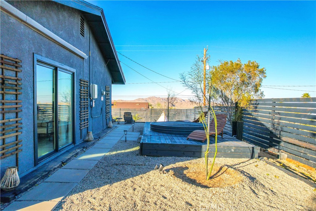 60670 Pueblo Trail Joshua Tree, CA 92252 - Photo 11 of 14 a house view with a backyard space