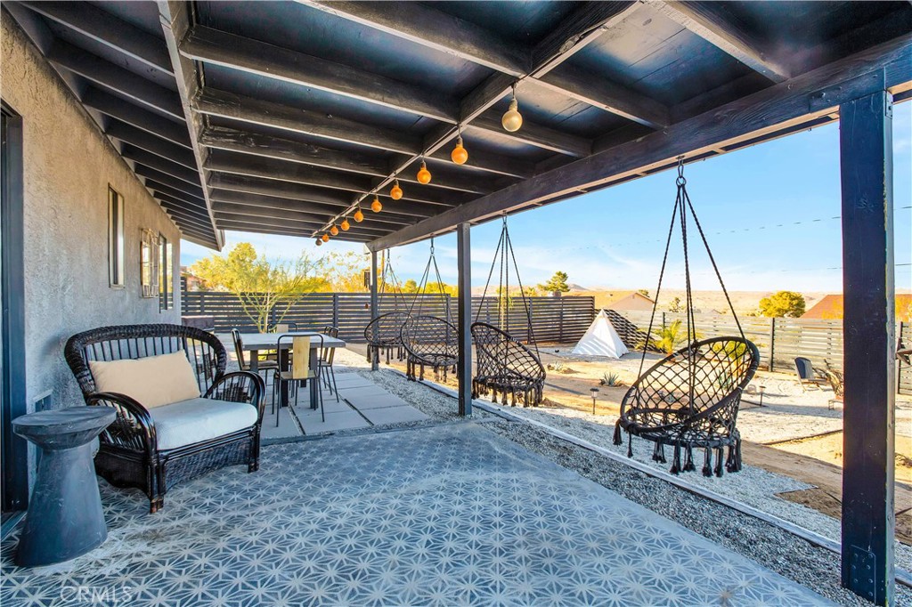 60670 Pueblo Trail Joshua Tree, CA 92252 - Photo 12 of 14 a building outdoor space with patio furniture