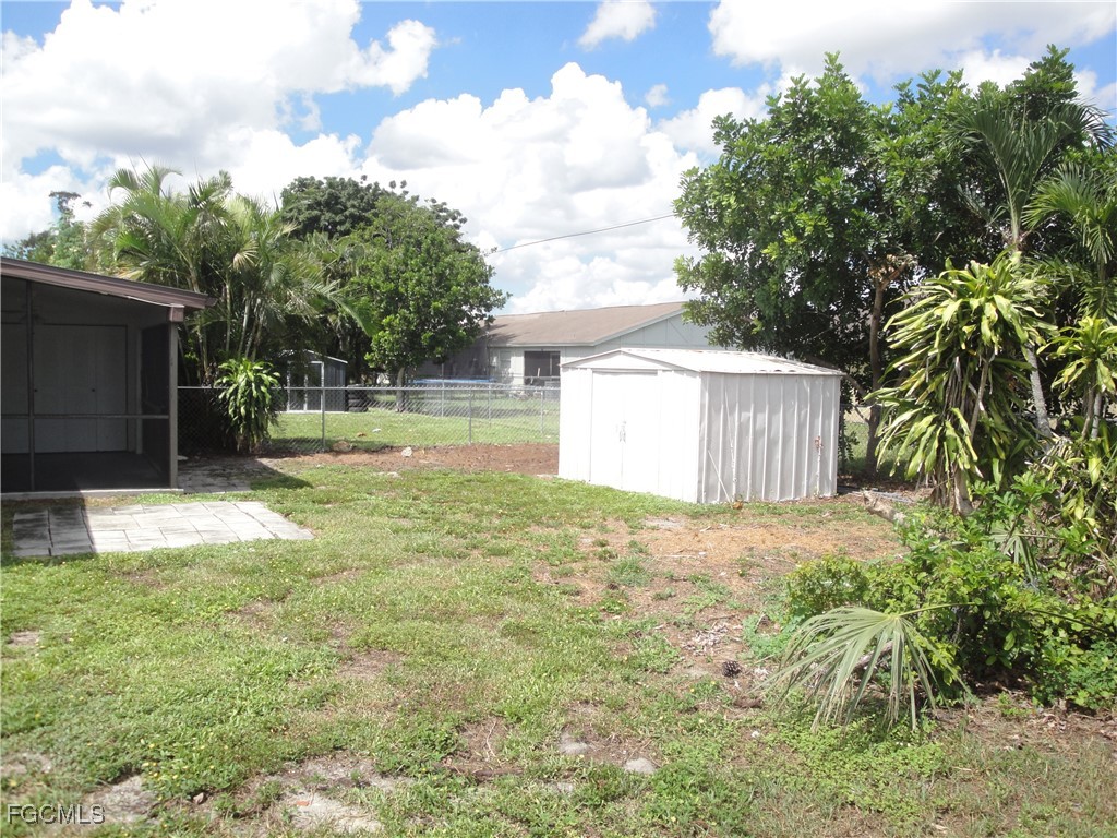 7487 Mellon Road Fort Myers, FL 33967 - Photo 8 of 10 a backyard of a house with lots of green space
