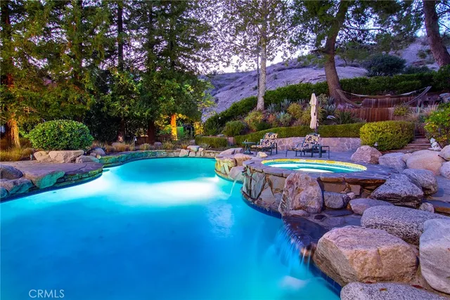 a garden with an outdoor seating