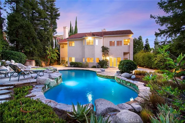 a view of a swimming pool with a patio