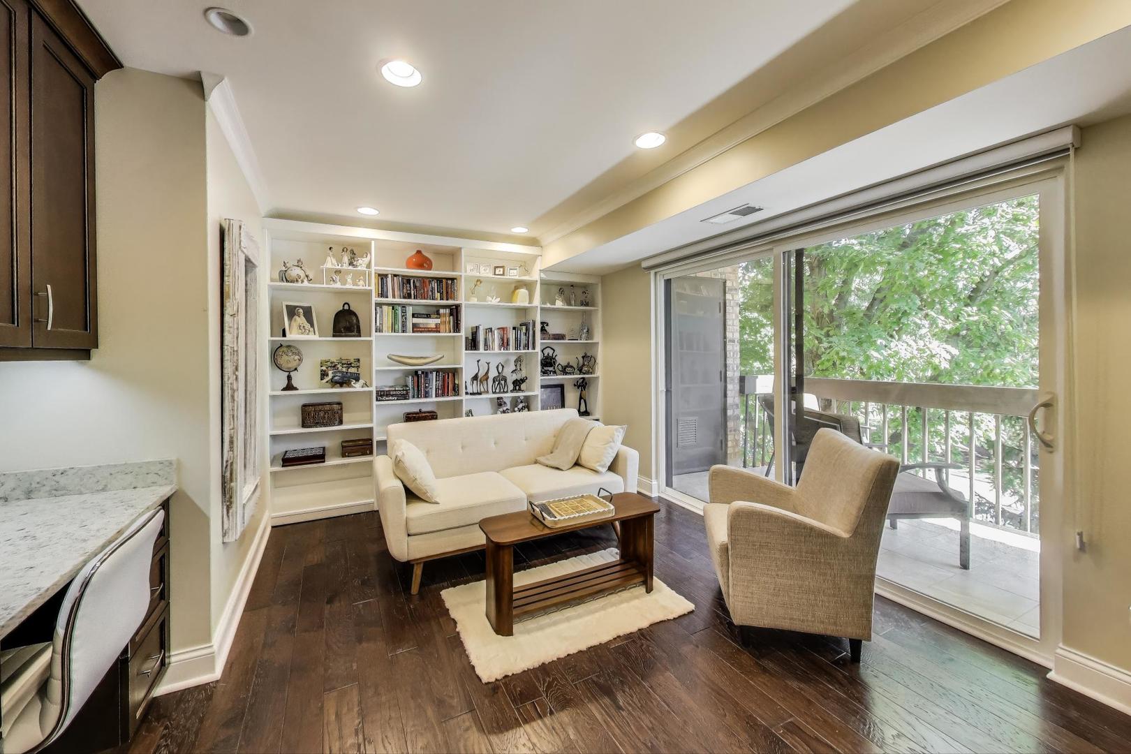 3810 Mission Hills Road, Unit 202 Northbrook, IL 60062 - Photo 11 of 25 a living room with furniture and a large window
