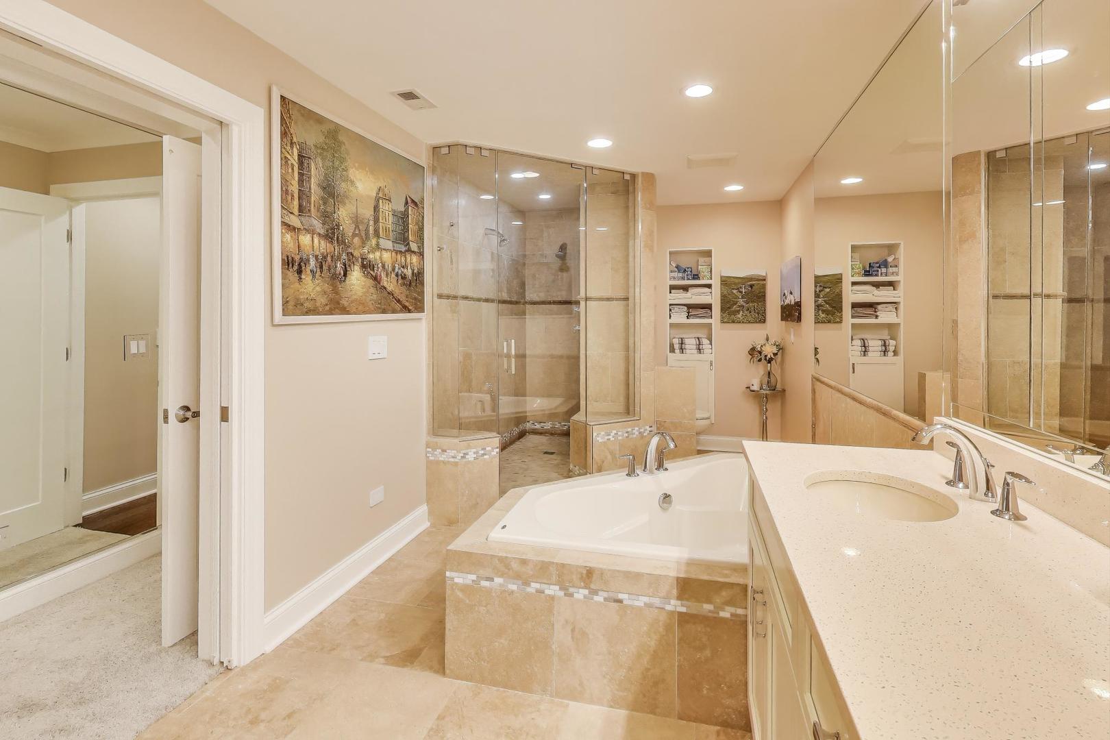 3810 Mission Hills Road, Unit 202 Northbrook, IL 60062 - Photo 15 of 25 a spacious bathroom with a tub sink and mirror