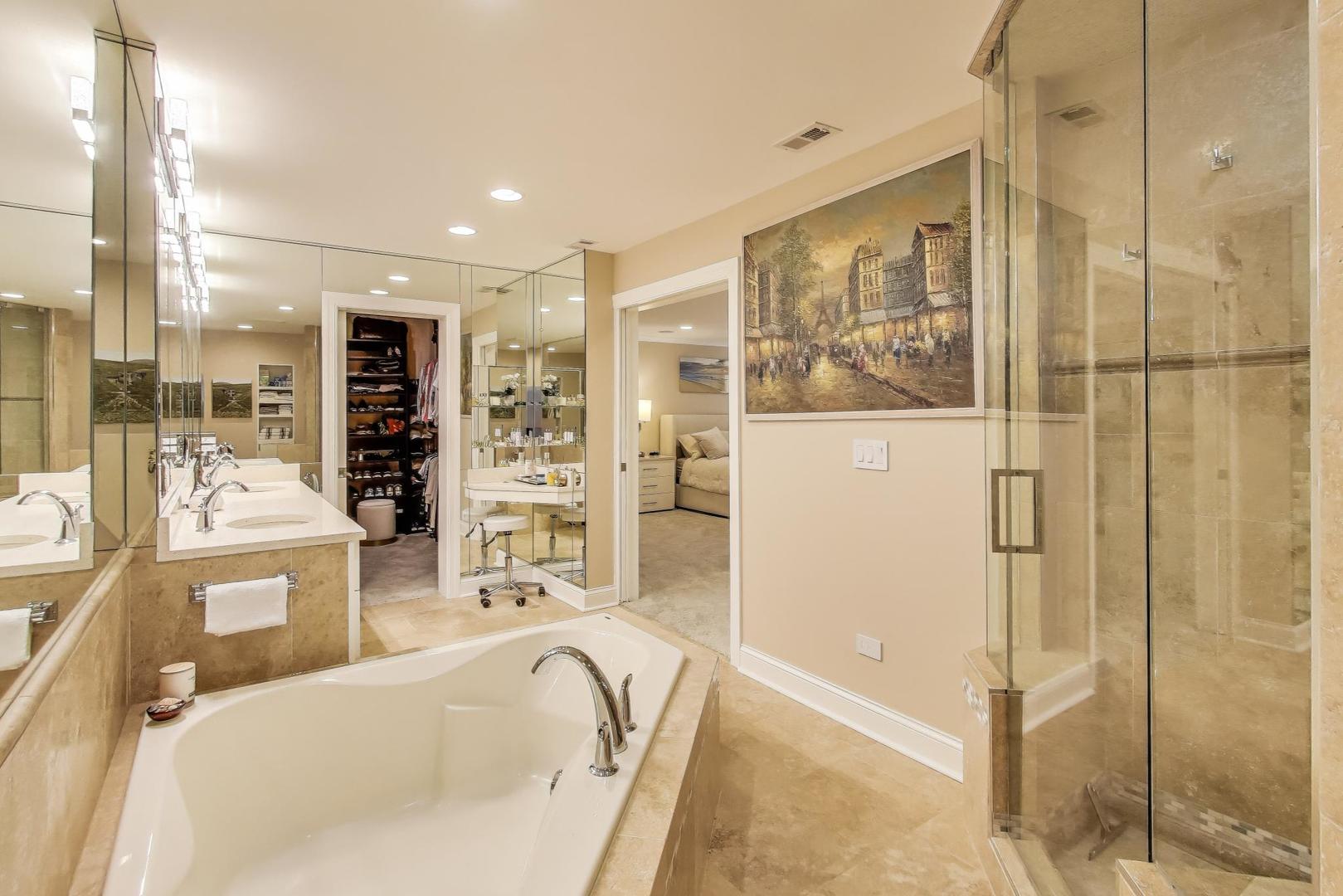 3810 Mission Hills Road, Unit 202 Northbrook, IL 60062 - Photo 16 of 25 a large bathroom with a tub and shower