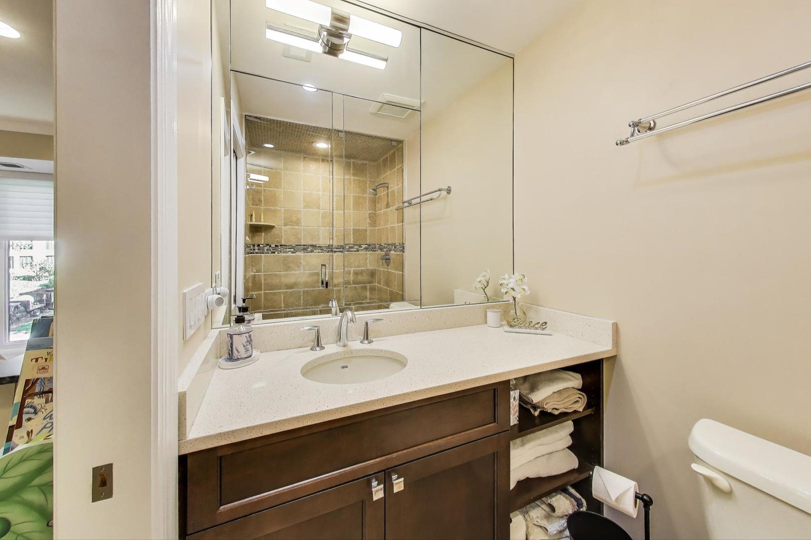 3810 Mission Hills Road, Unit 202 Northbrook, IL 60062 - Photo 19 of 25 a bathroom with a sink double vanity and a mirror