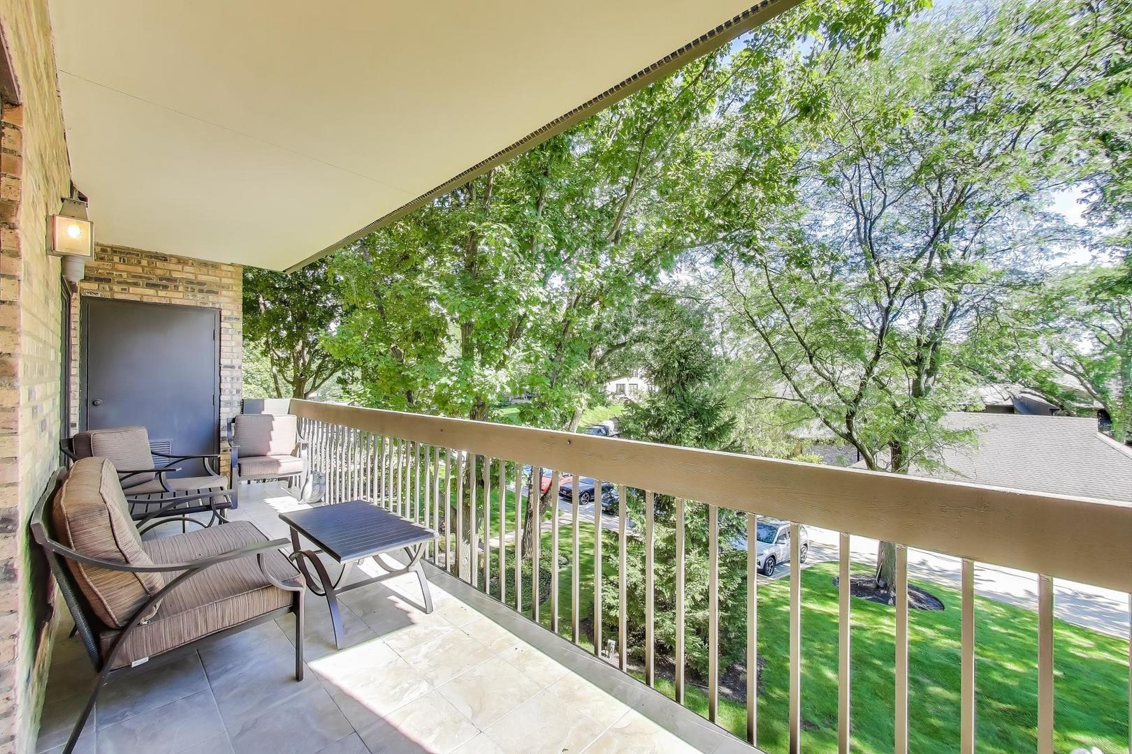 3810 Mission Hills Road, Unit 202 Northbrook, IL 60062 - Photo 22 of 25 a balcony with wooden floor and outdoor space
