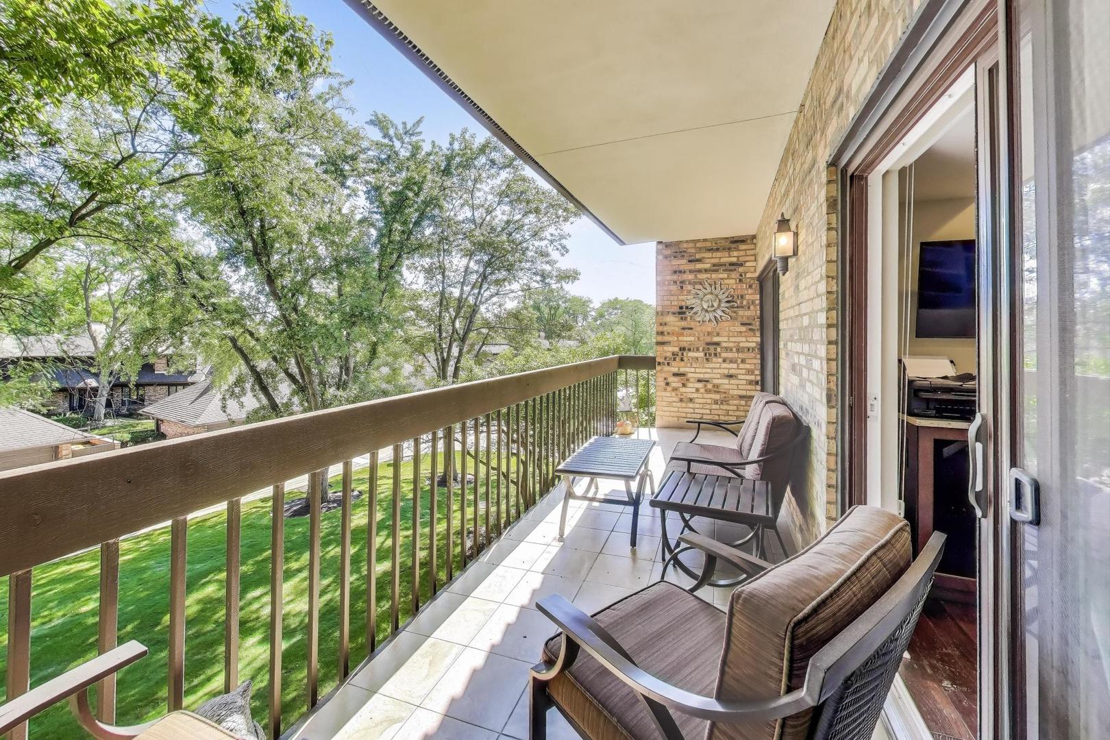 3810 Mission Hills Road, Unit 202 Northbrook, IL 60062 - Photo 23 of 25 a view of a chairs and table in patio with wooden floor