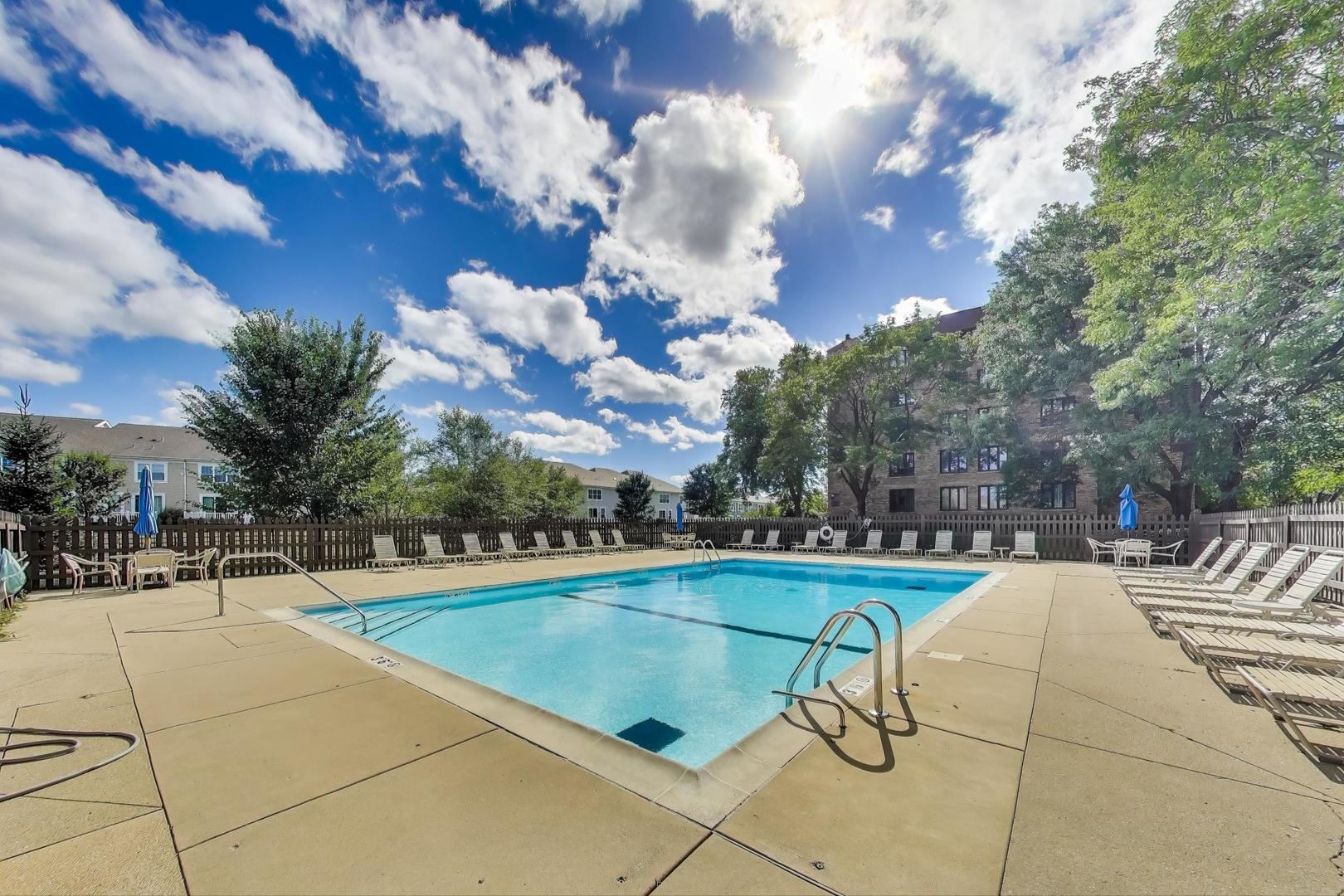 3810 Mission Hills Road, Unit 202 Northbrook, IL 60062 - Photo 25 of 25 a view of a swimming pool with a garden