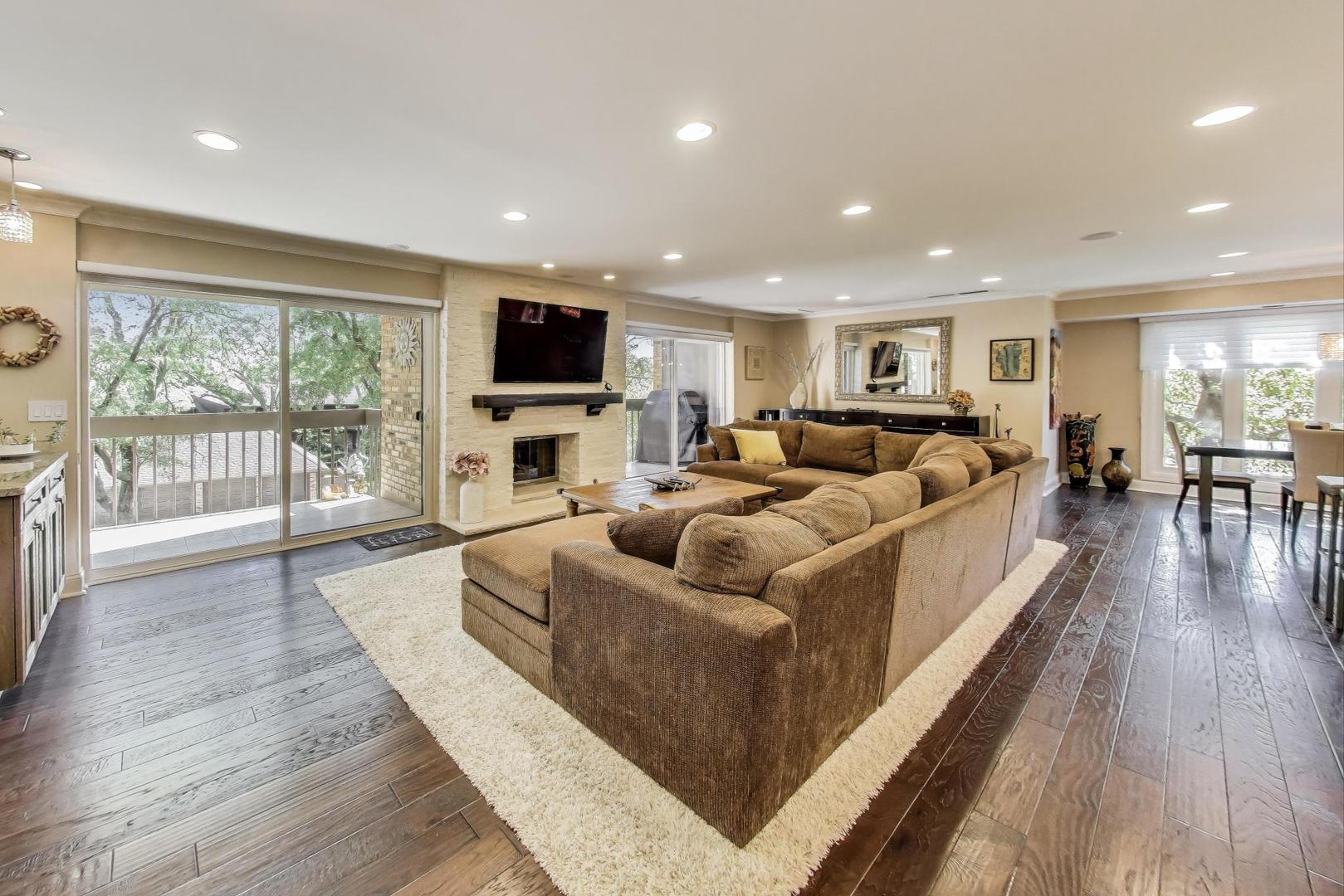 3810 Mission Hills Road, Unit 202 Northbrook, IL 60062 - Photo 4 of 25 a living room with furniture flat screen tv and wooden floor