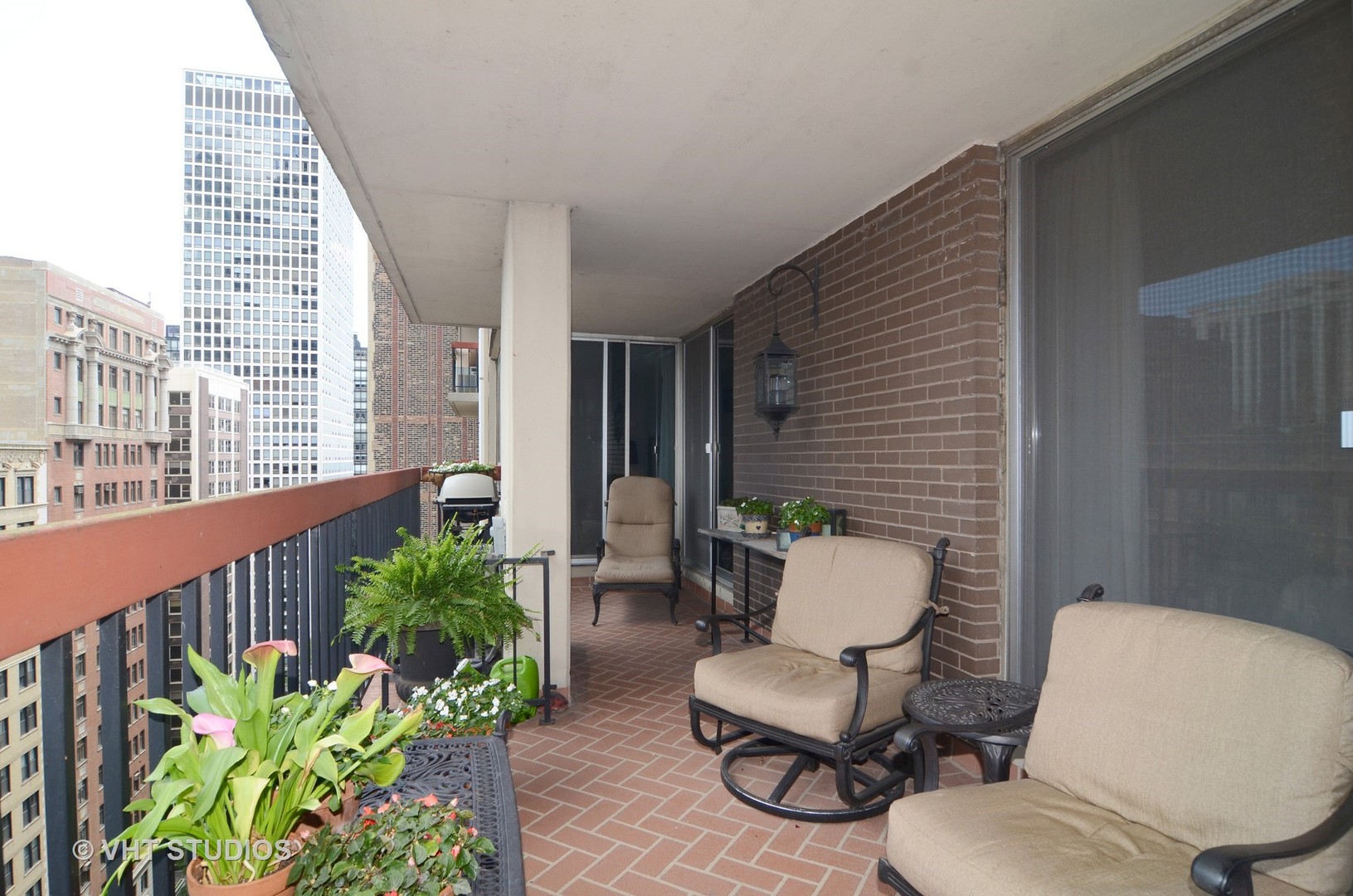 201 East Chestnut Street, Unit 20A Chicago, IL 60611 - Photo 11 of 13 a view of a chair and table in the balcony