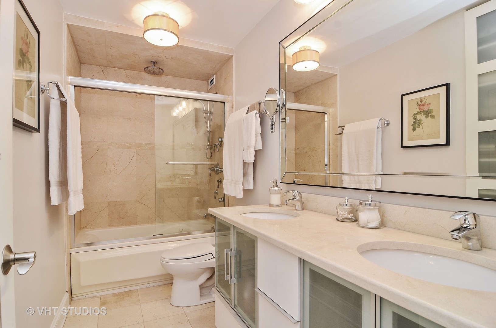 201 East Chestnut Street, Unit 20A Chicago, IL 60611 - Photo 7 of 13 a bathroom with a granite countertop sink a toilet and shower