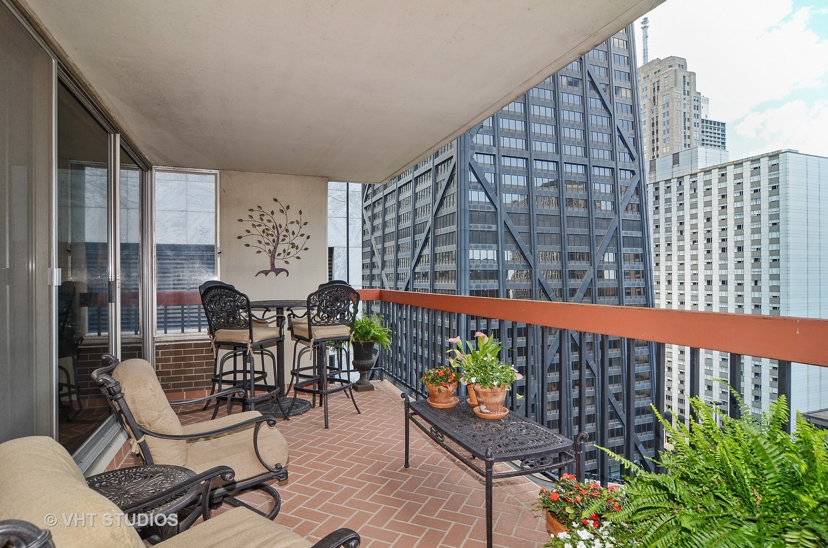 201 East Chestnut Street, Unit 20A Chicago, IL 60611 - Photo 10 of 13 a view of a chairs and tables in the balcony