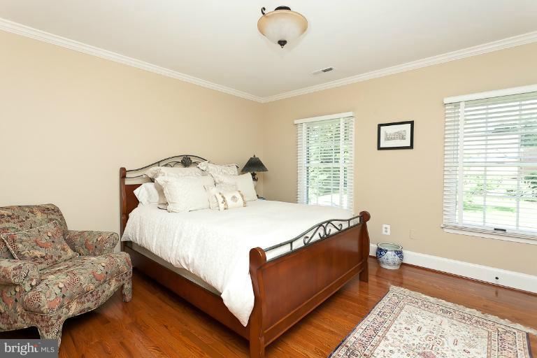 7 Roland Court Towson, MD 21204 - Photo 13 of 25 a bedroom with a bed and a couch