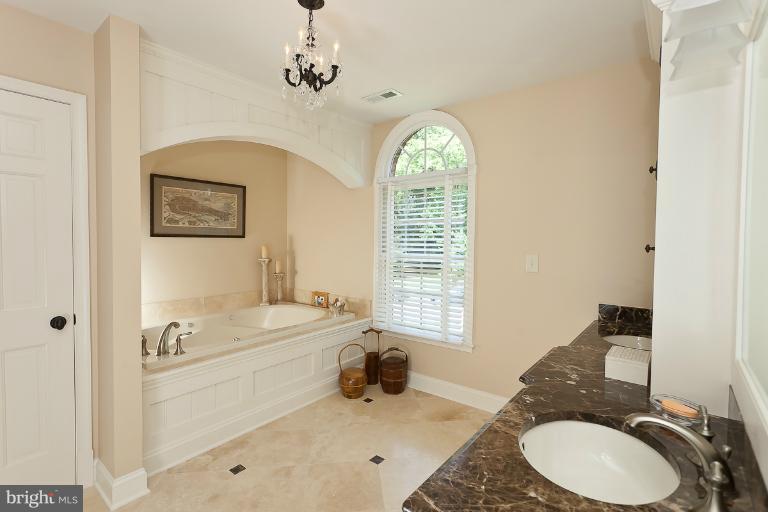 7 Roland Court Towson, MD 21204 - Photo 14 of 25 a bathroom with a sink a toilet and a mirror