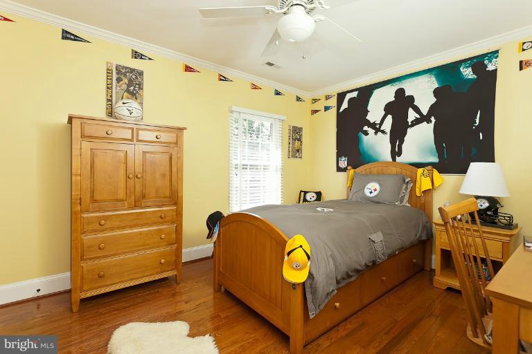 7 Roland Court Towson, MD 21204 - Photo 18 of 25 a bed room with a bed and a window