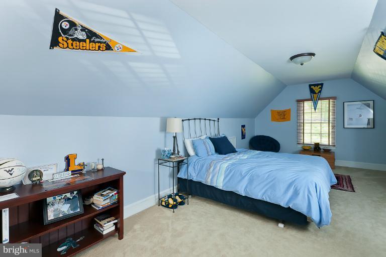 7 Roland Court Towson, MD 21204 - Photo 2 of 25 a bedroom with a bed and a window