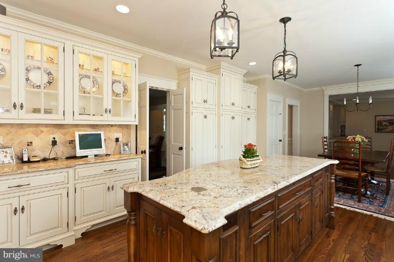 7 Roland Court Towson, MD 21204 - Photo 21 of 25 a kitchen with center island center island and stainless steel appliances