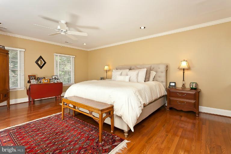 7 Roland Court Towson, MD 21204 - Photo 4 of 25 a spacious bedroom with a bed and wooden floor