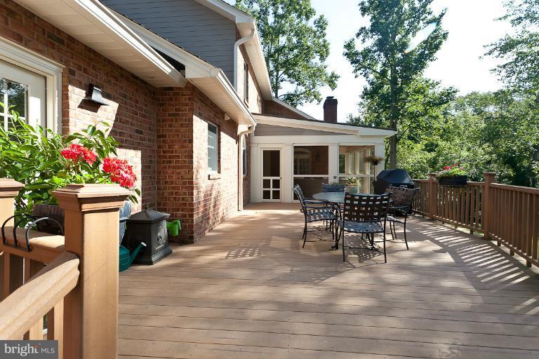 7 Roland Court Towson, MD 21204 - Photo 7 of 25 a view of a house with patio and a garden