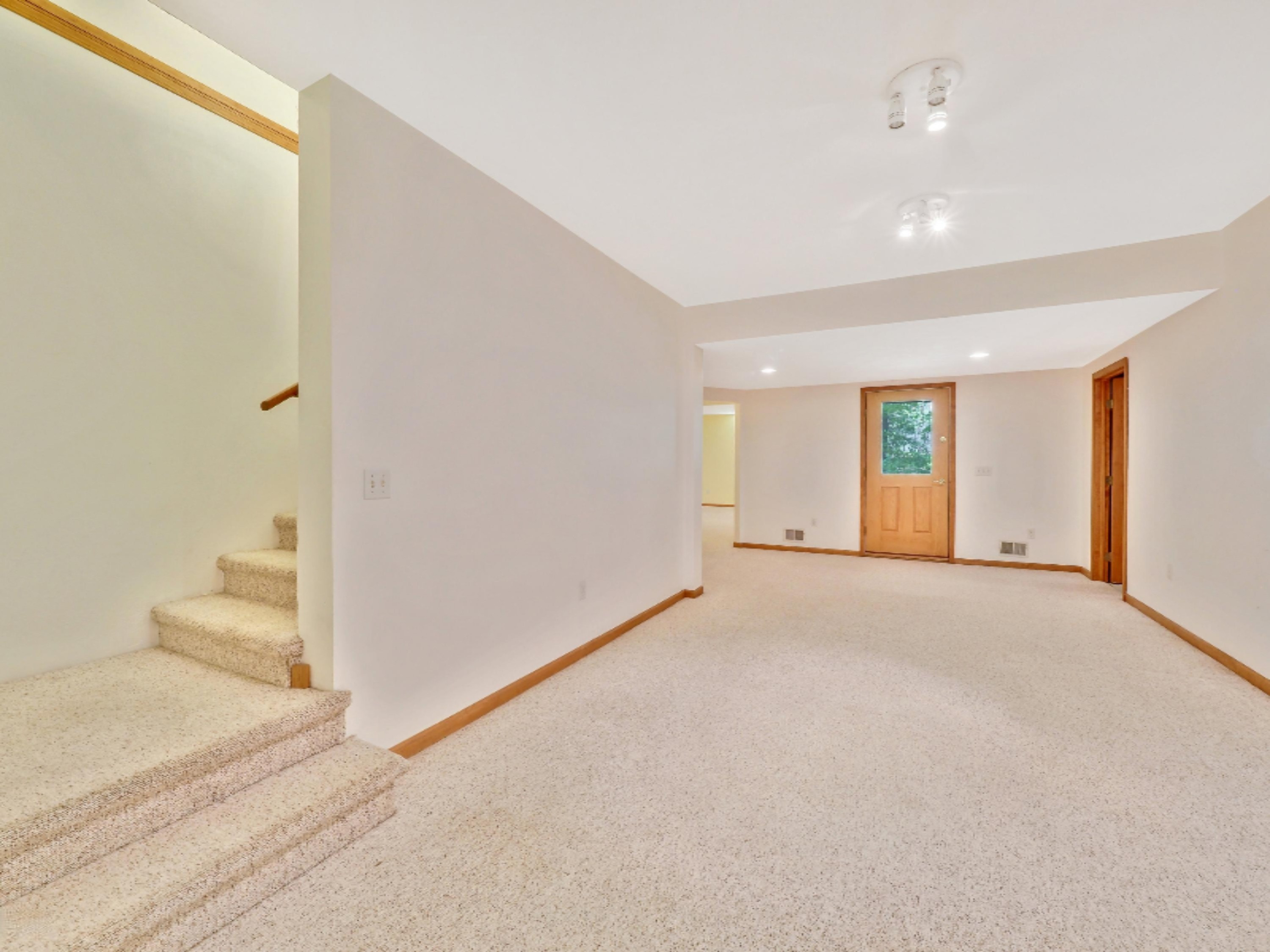 3669 Rakoniewski Road Manistee, MI 49660 - Photo 18 of 32 Stairs down to Walk-Out Lower Level