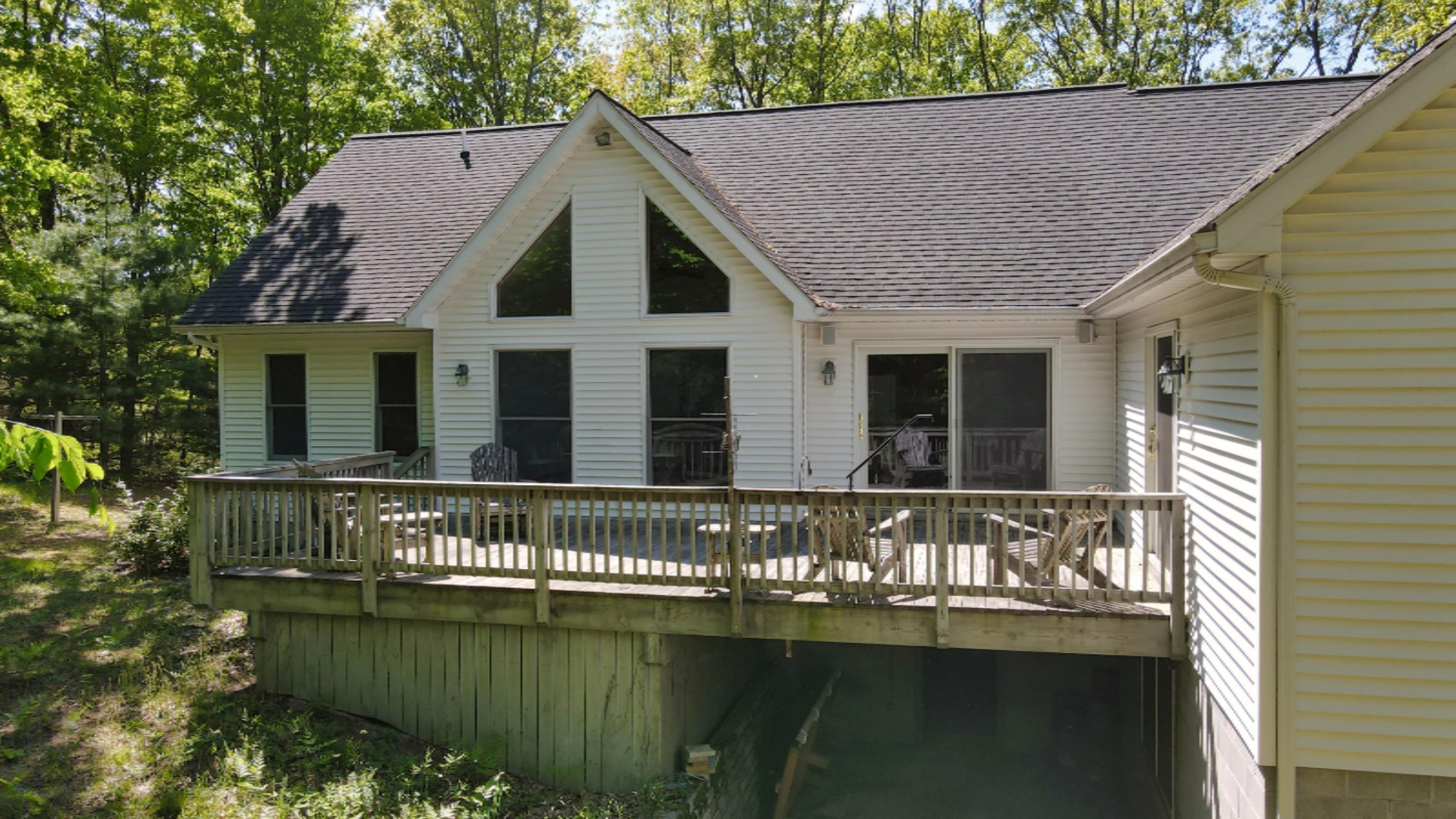 3669 Rakoniewski Road Manistee, MI 49660 - Photo 2 of 32 Huge Back Deck overlooks Wooded 10 Acres