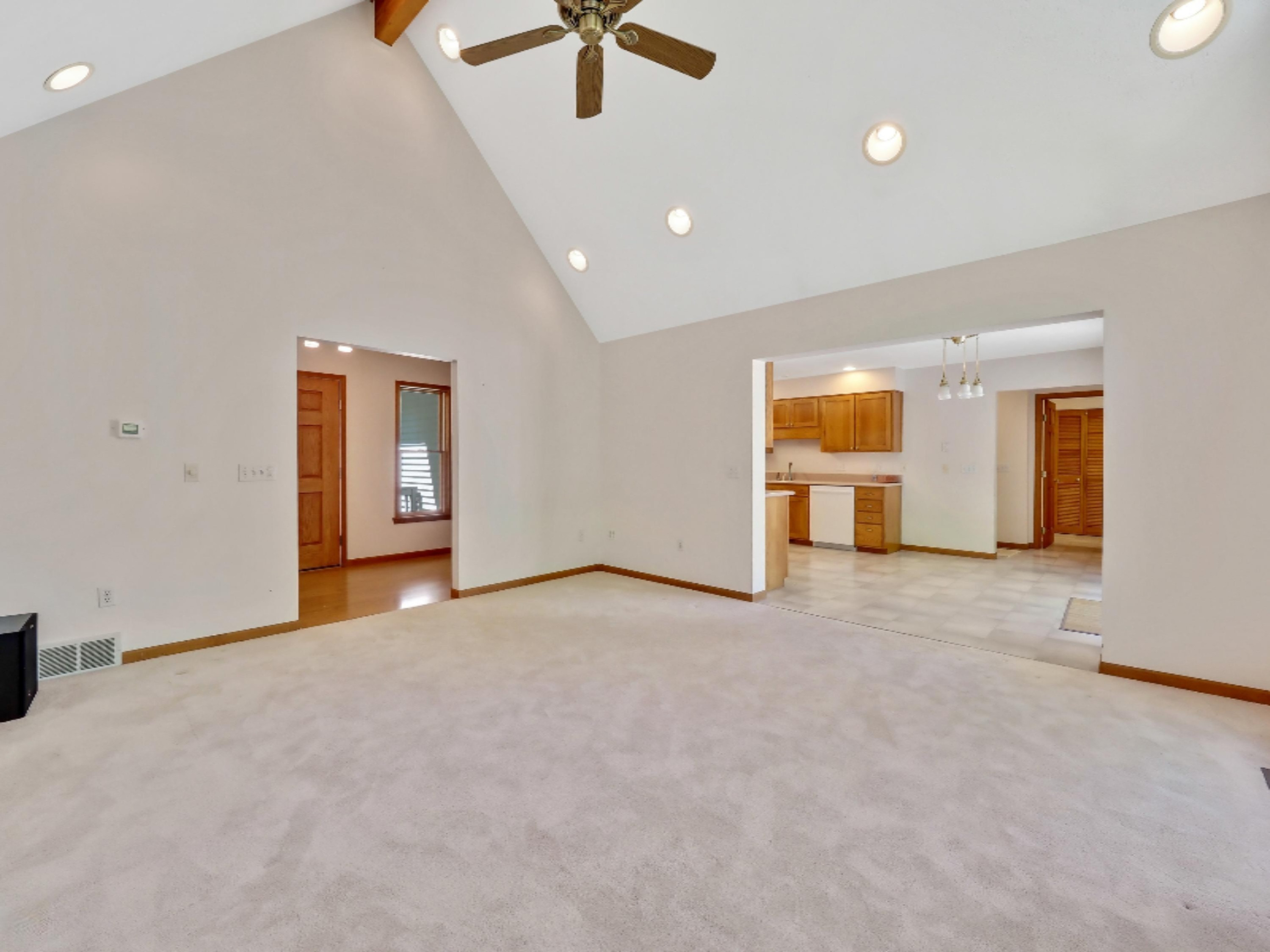 3669 Rakoniewski Road Manistee, MI 49660 - Photo 6 of 32 Living Room into Dining Area and Kitchen