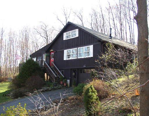 254 Bennetts Farm Road Ridgefield, CT 06877 - Photo 1 of 1 a front view of a house with a yard