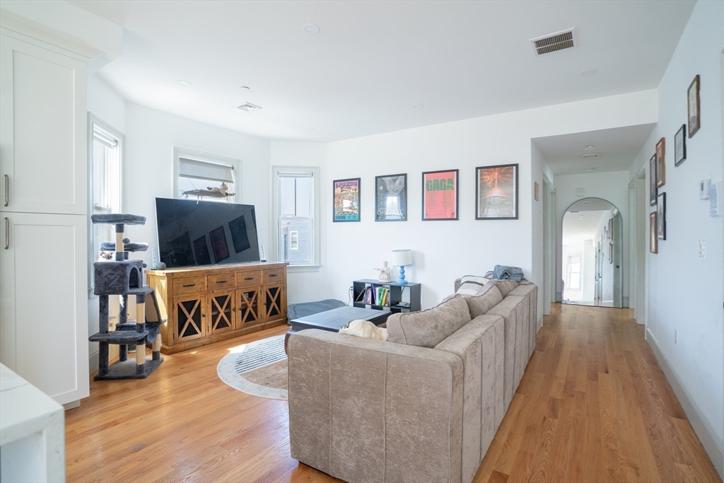16 Church Street Boston, MA 02122 - Photo 15 of 23 a living room with furniture and a flat screen tv