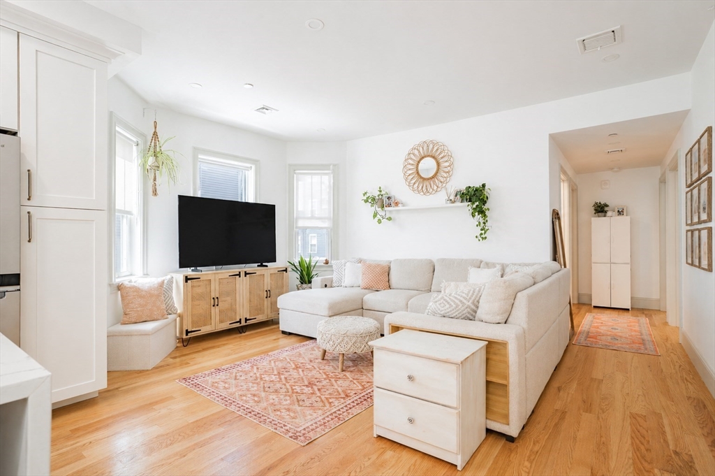 16 Church Street Boston, MA 02122 - Photo 4 of 23 a living room with furniture and a flat screen tv