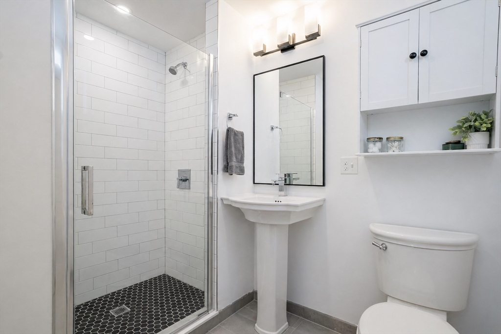 16 Church Street Boston, MA 02122 - Photo 7 of 23 a bathroom with a sink toilet and shower