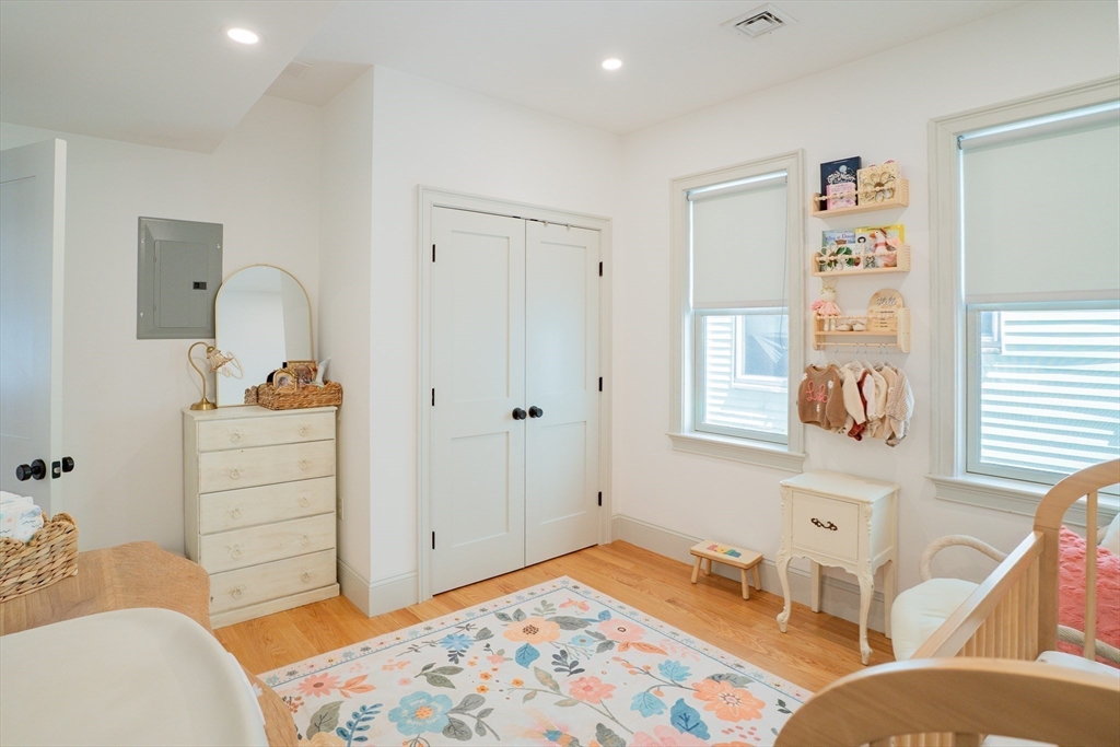 16 Church Street Boston, MA 02122 - Photo 9 of 23 a bedroom with a bed and a cabinets