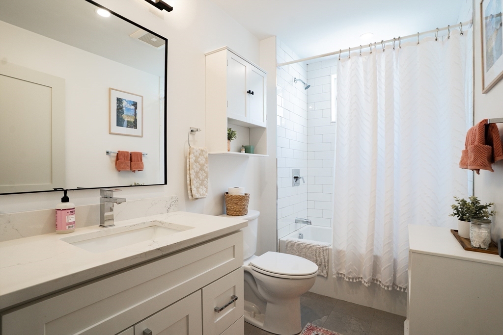 16 Church Street Boston, MA 02122 - Photo 10 of 23 a bathroom with a sink a toilet and shower