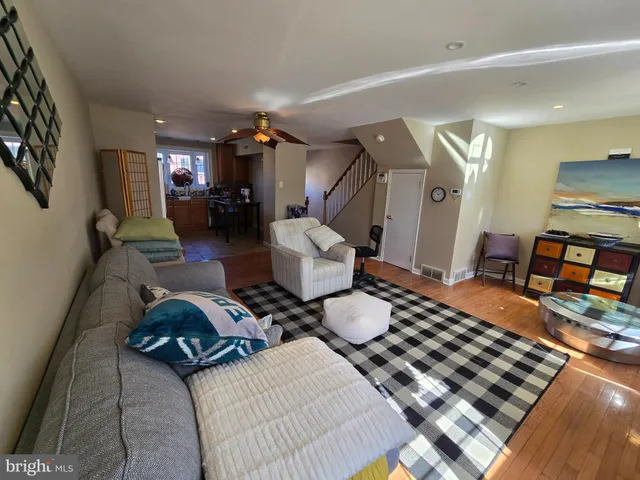 a bedroom with furniture and a wooden floor