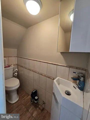 a bathroom with a sink and toilet