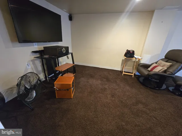 a room with furniture and a flat screen tv