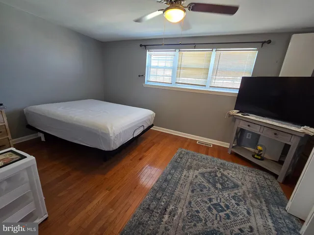 a bedroom with bed and a window