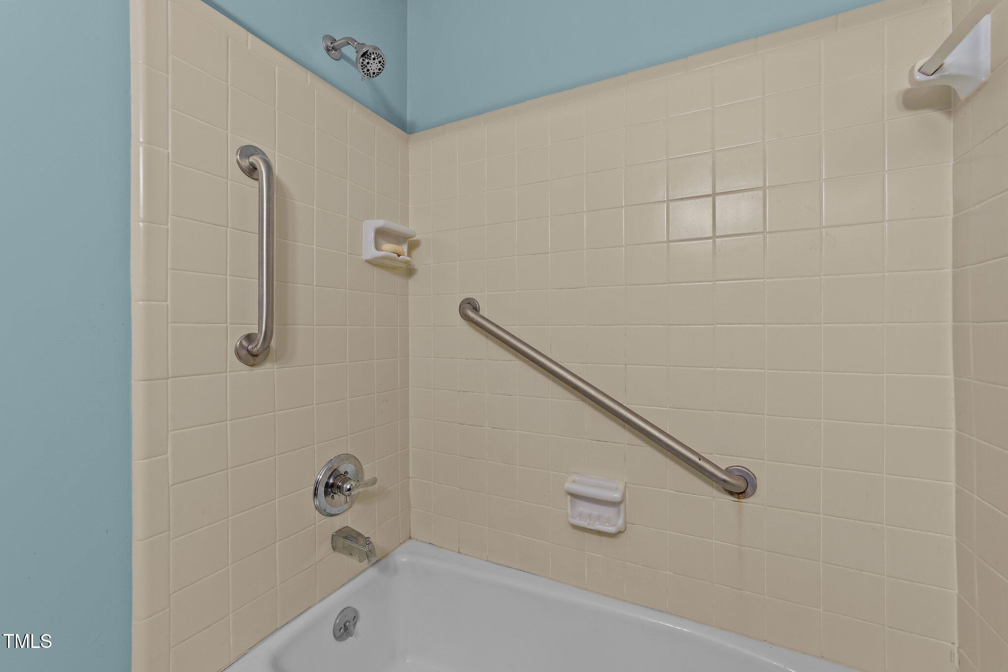 906 Bridge Way Raleigh, NC 27615 - Photo 20 of 30 a bathroom with a bathtub