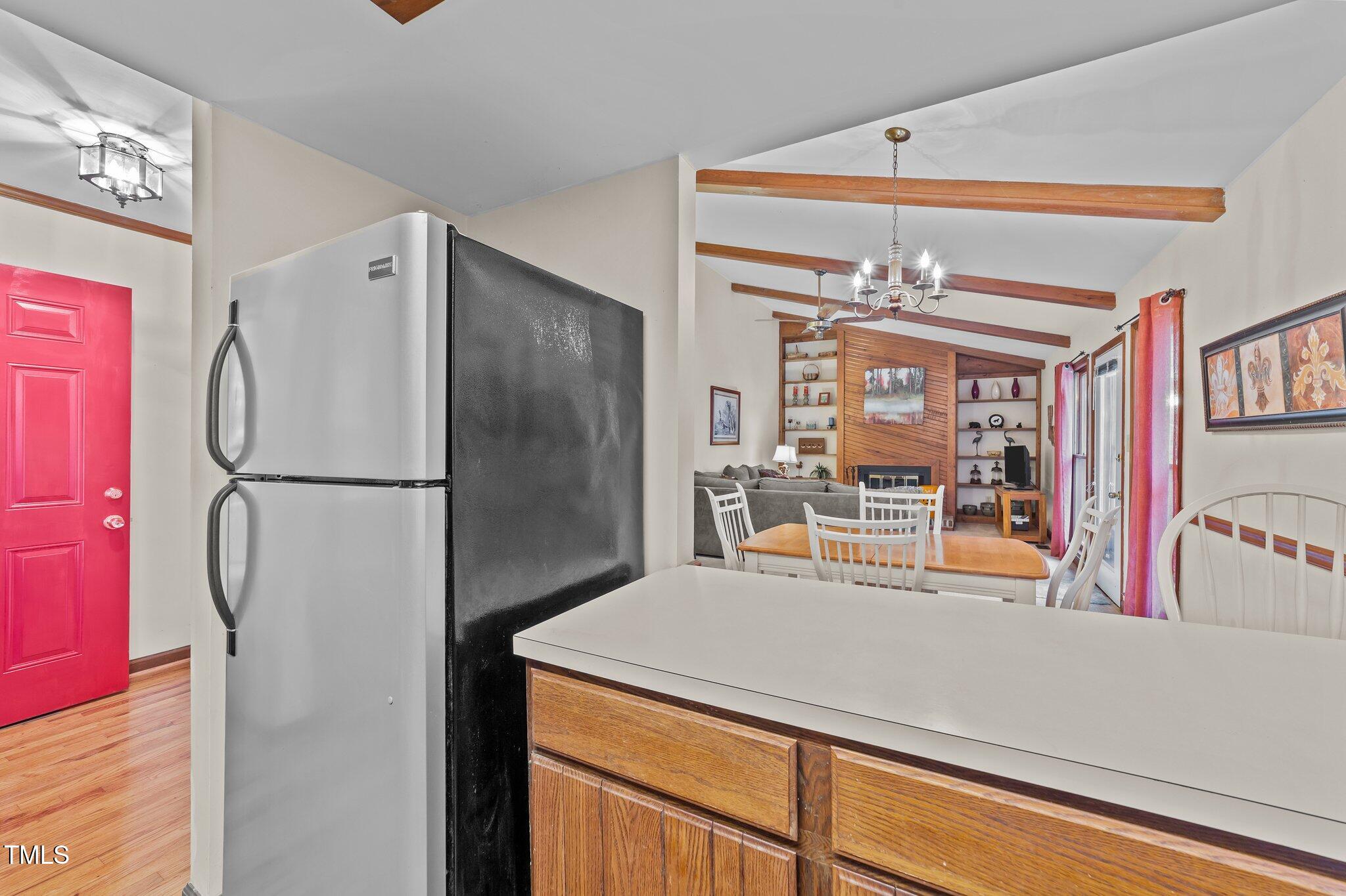906 Bridge Way Raleigh, NC 27615 - Photo 10 of 30 a kitchen with a refrigerator and a refrigerator
