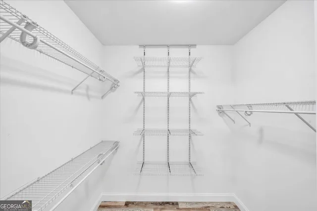 a spacious bathroom with a double vanity sink and mirror