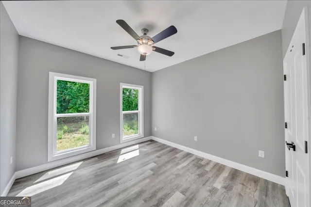a view of a livingroom with a ceiling fan