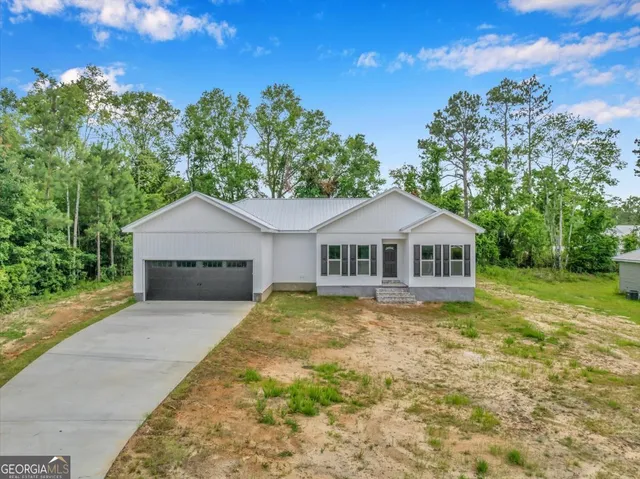 a front view of a house with yard