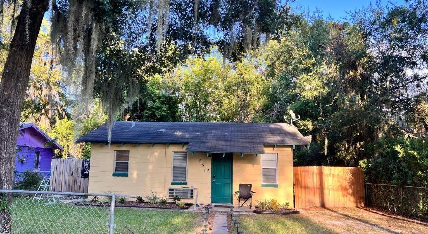a view of a house with a yard