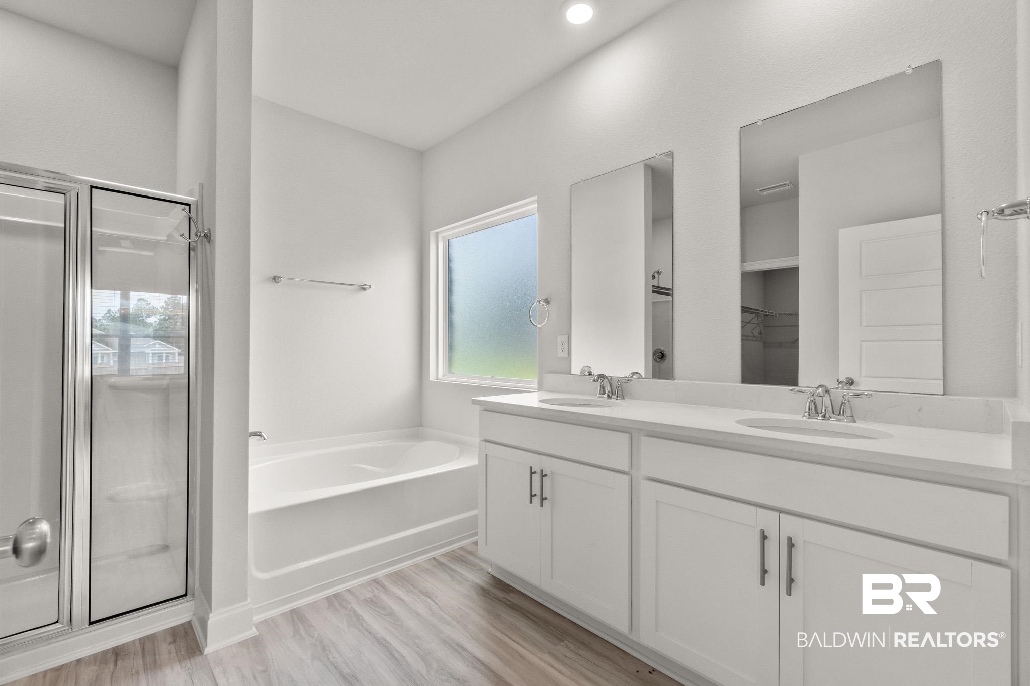 32125 Lyon Road Daphne, AL 36527 - Photo 14 of 70 Double vanity with white cabinetry and chrome hardware