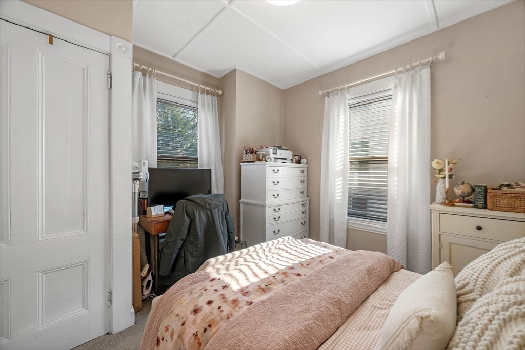 36 Stone Street Beverly, MA 01915 - Photo 16 of 42 a bedroom with a bed and a window