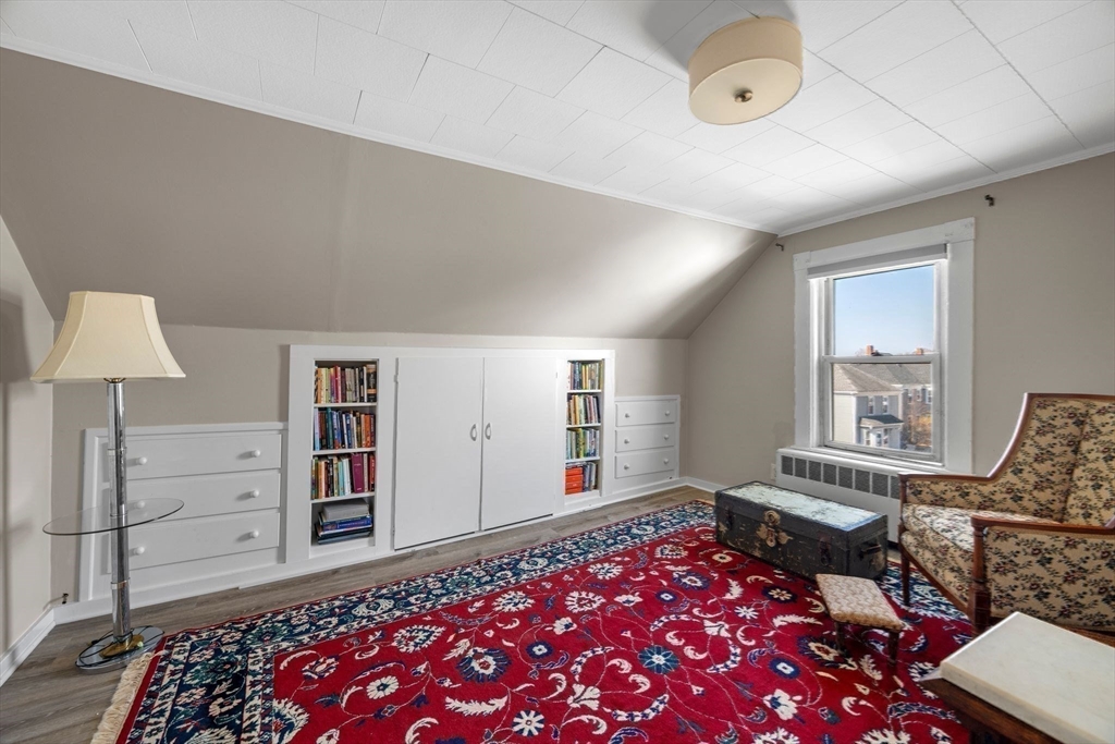 36 Stone Street Beverly, MA 01915 - Photo 20 of 42 a bedroom with furniture and a book shelf