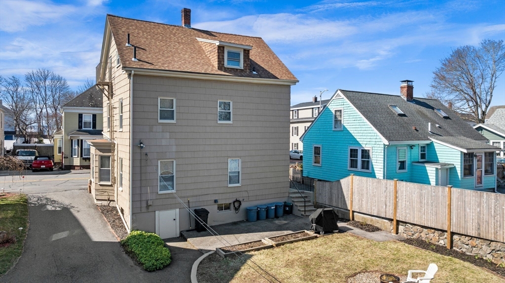 36 Stone Street Beverly, MA 01915 - Photo 2 of 42 a front view of a house with a yard